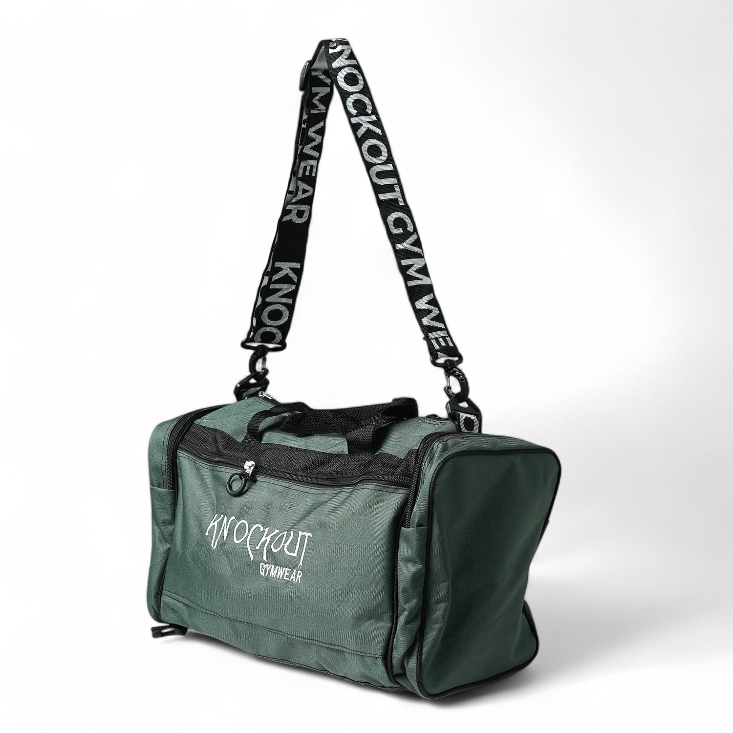 Green Knockout brand gym bag with shoulder strap and multiple compartments