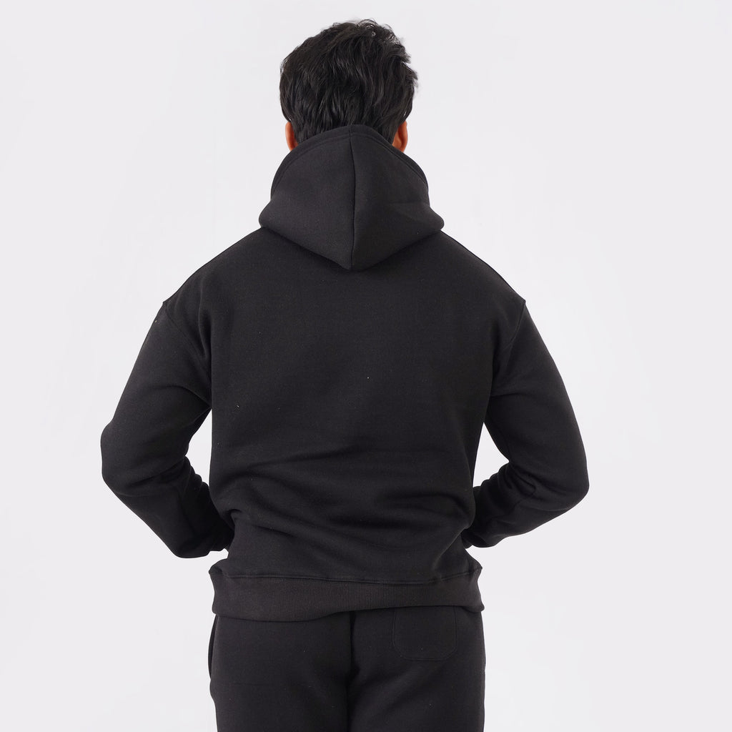 Black oversized tracksuit for men with a relaxed, comfortable fit.
