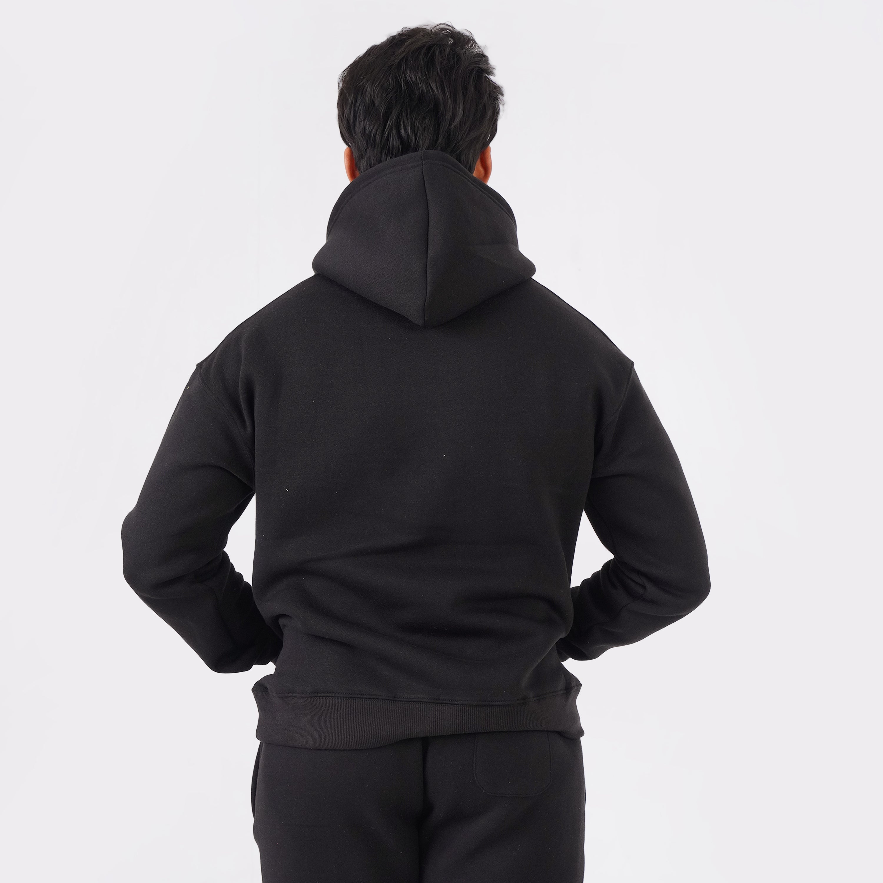 Black oversized tracksuit for men with a relaxed, comfortable fit.
