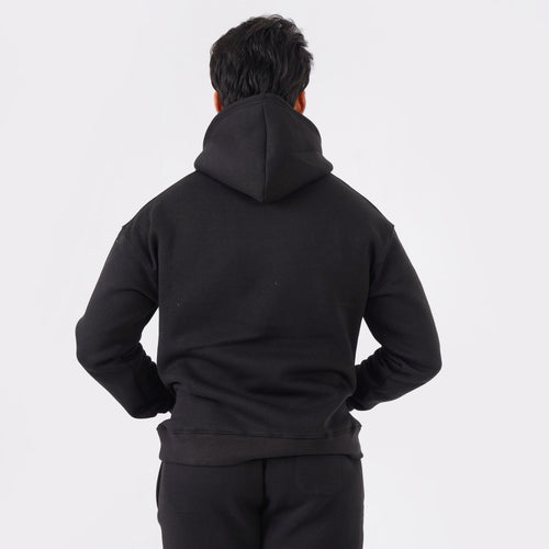 Black oversized tracksuit for men with a relaxed, comfortable fit.
