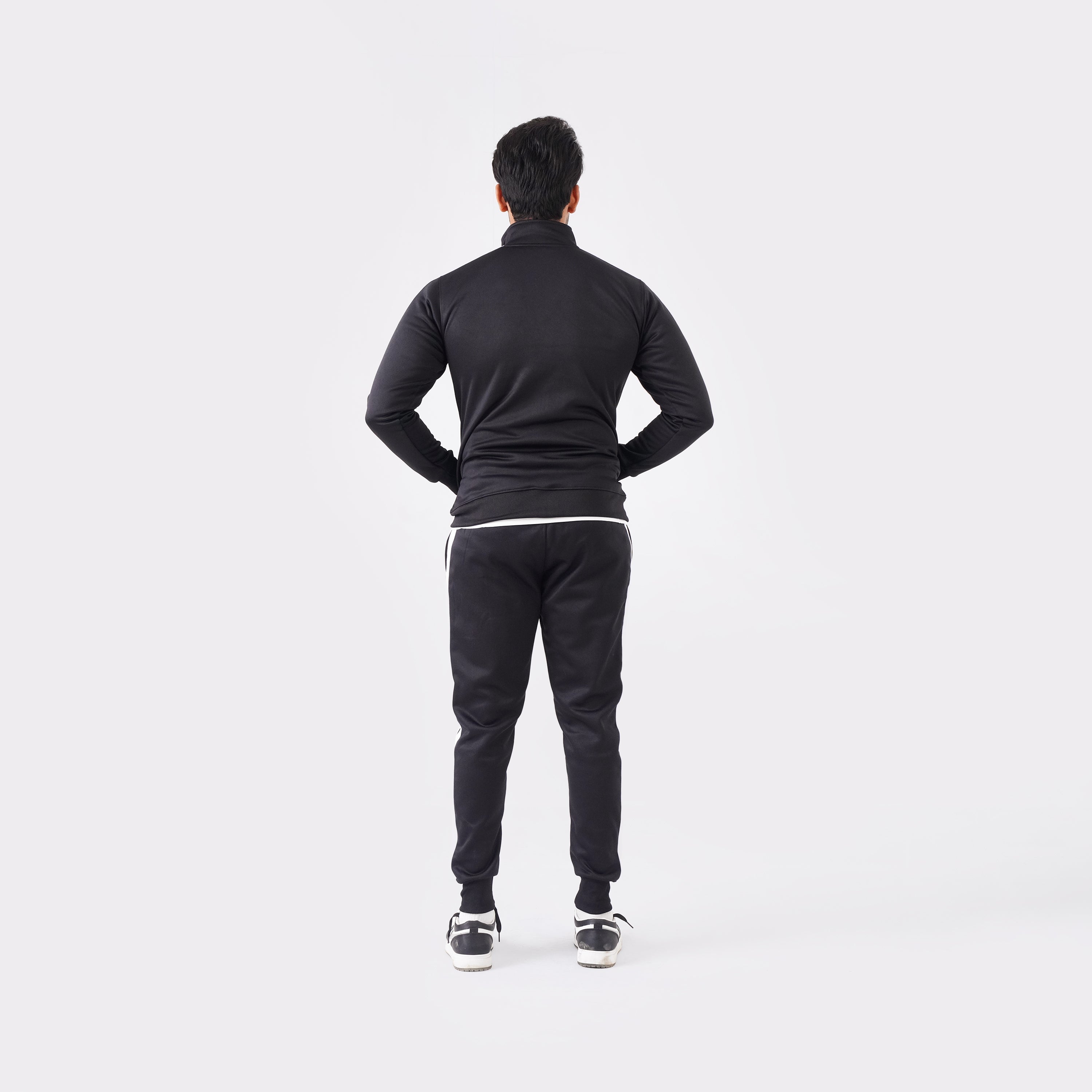 Men’s black athletic tracksuit with side stripes for gym and casual style.
