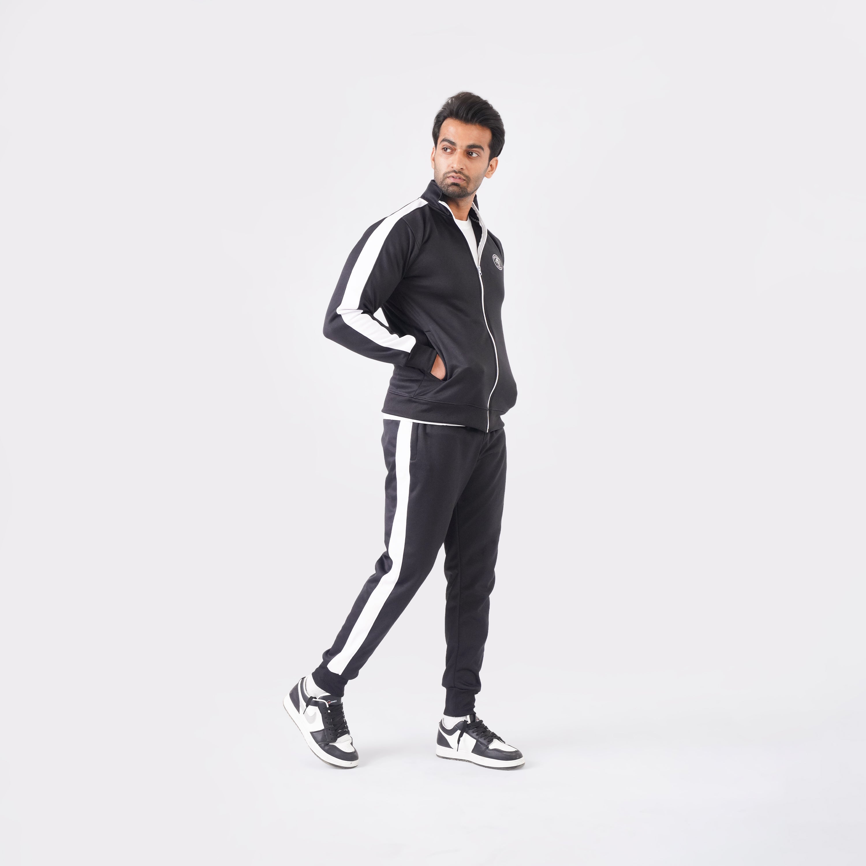 Men’s black athletic tracksuit with side stripes for gym and casual style.
