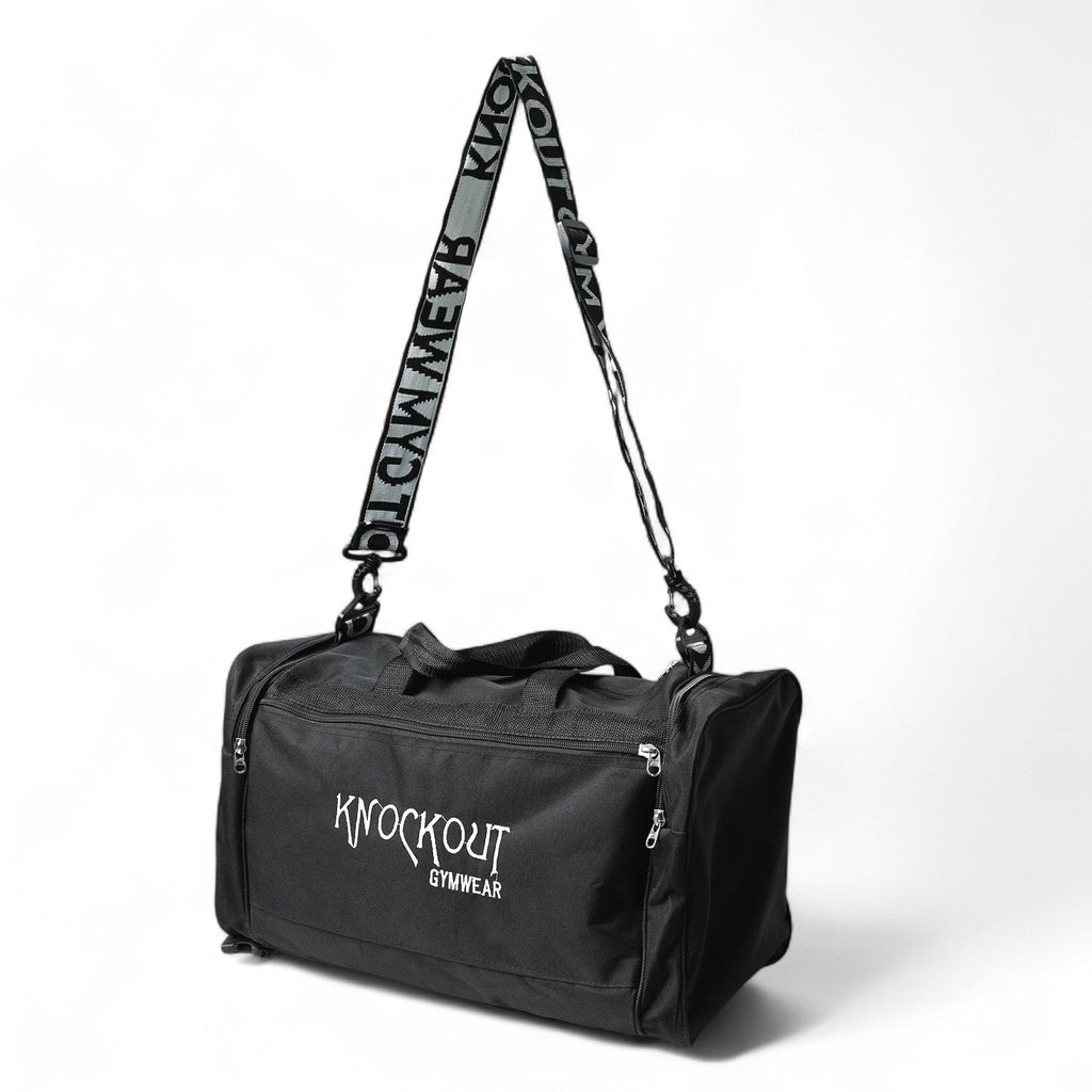 Black gym bag with a front and shoe pocket and shoulder strap 