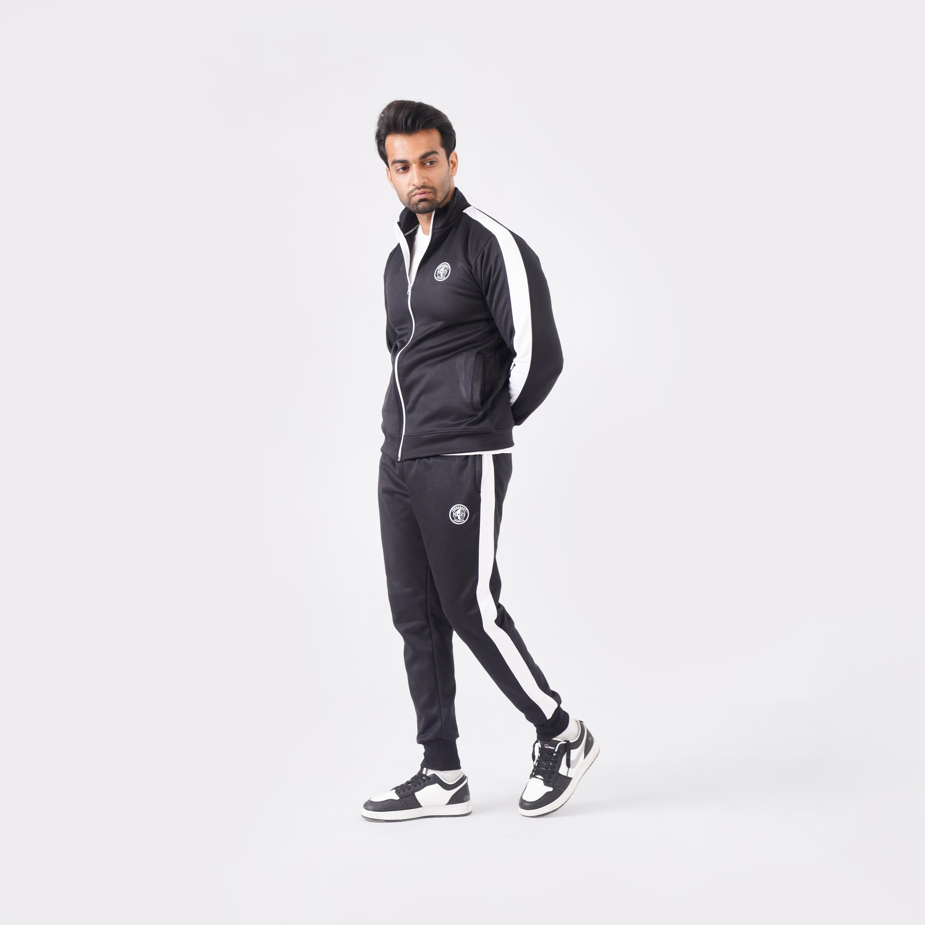 Men’s black athletic tracksuit with side stripes for gym and casual style.
