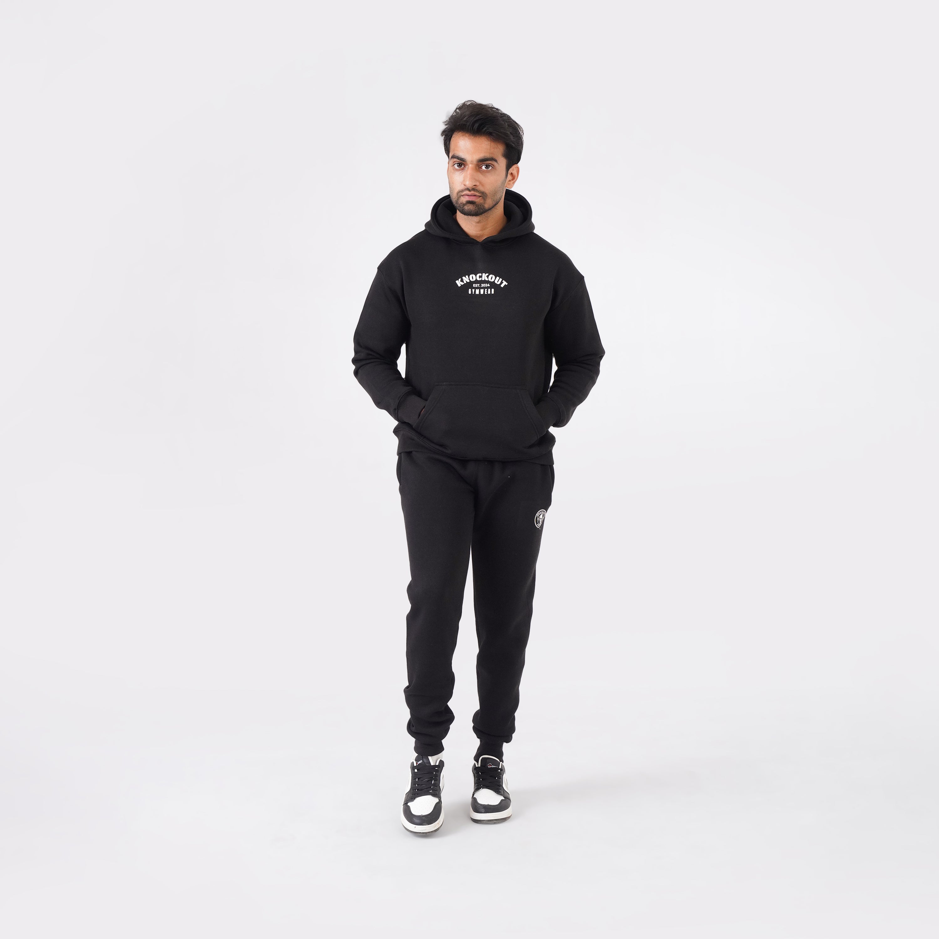 Black oversized tracksuit for men with a relaxed, comfortable fit.

