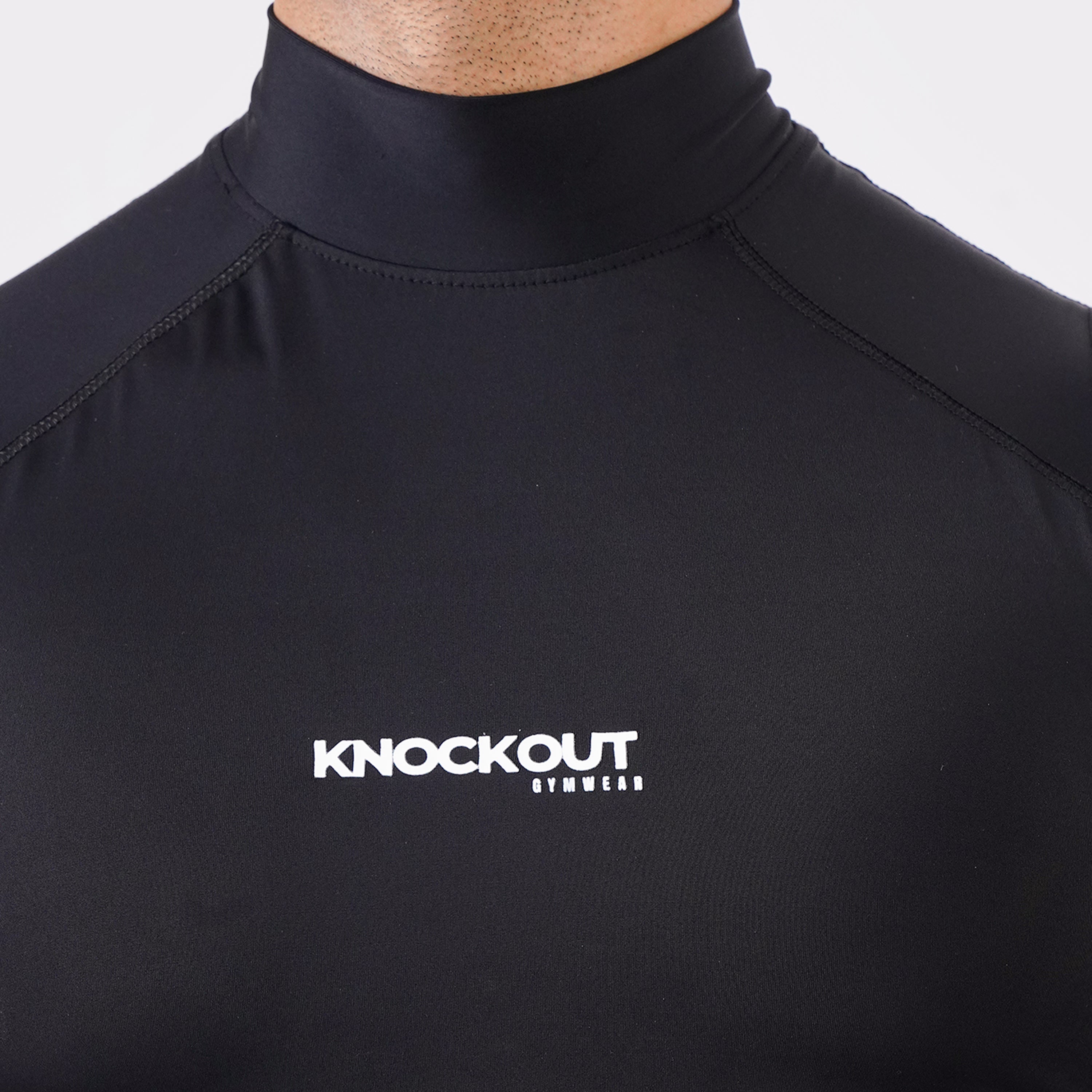 Knockout Black sleeveless high-neck compression shirt for men’s activewear.
