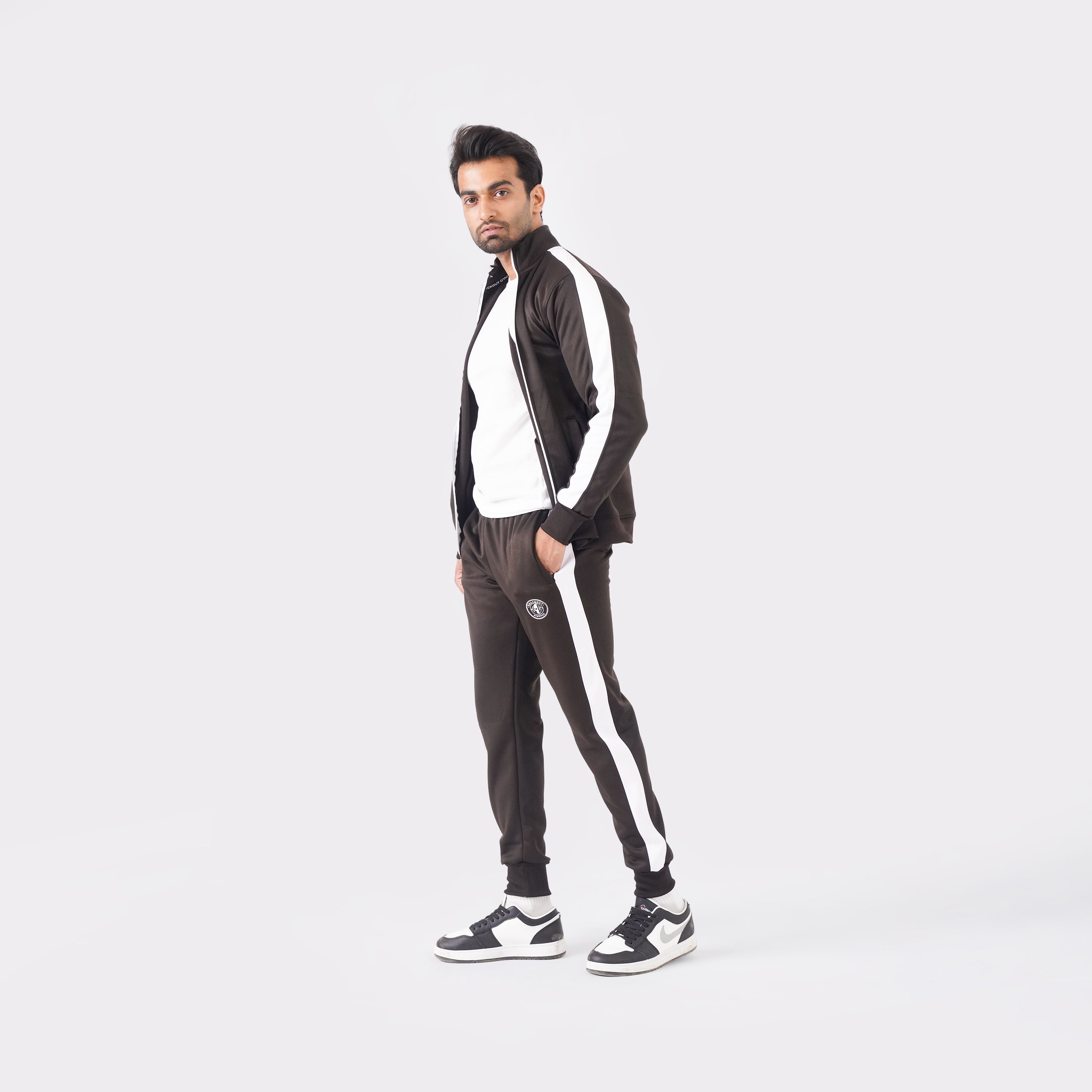 Men’s chocolate athletic tracksuit with side stripes for gym and casual style.
