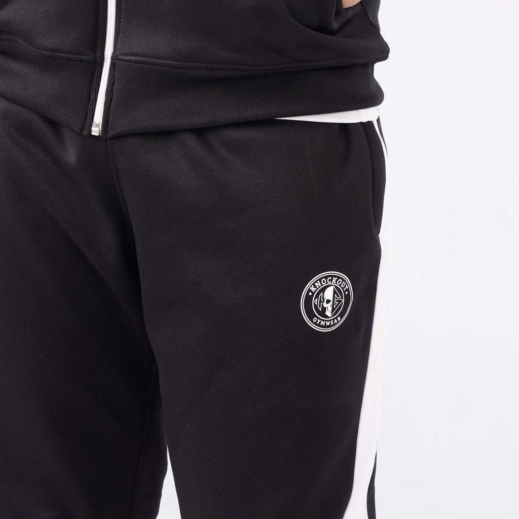 Men’s black athletic tracksuit with side stripes for gym and casual style.
