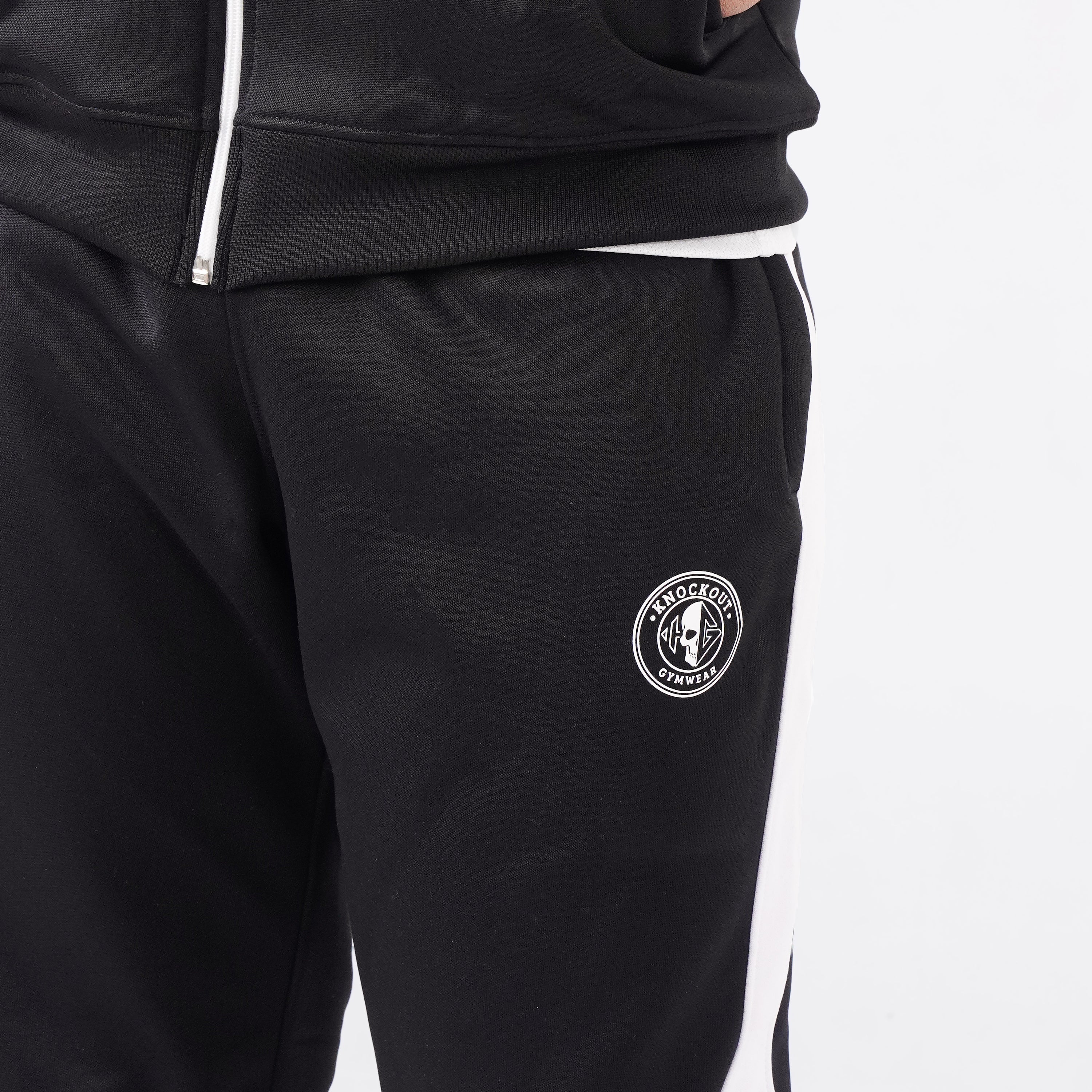 Men’s black athletic tracksuit with side stripes for gym and casual style.
